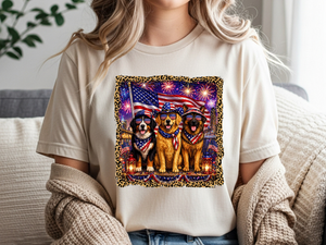 Person wearing a white t-shirt with a graphic of three dogs in patriotic attire and an American flag. Person wearing a white t-shirt with a graphic of three dogs in patriotic attire and an American flag.
