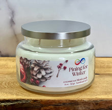 Load image into Gallery viewer, Candle jar labeled &#39;Pining for Winter&#39; on a wooden surface with a neutral background
