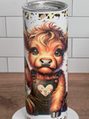 Tumbler with a cow design on a wooden surface and white tiled wall background